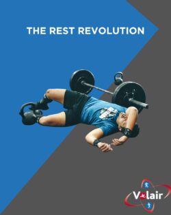 Rest revolution on a black and grey. with someone recovering on the floor after a tough deadlift