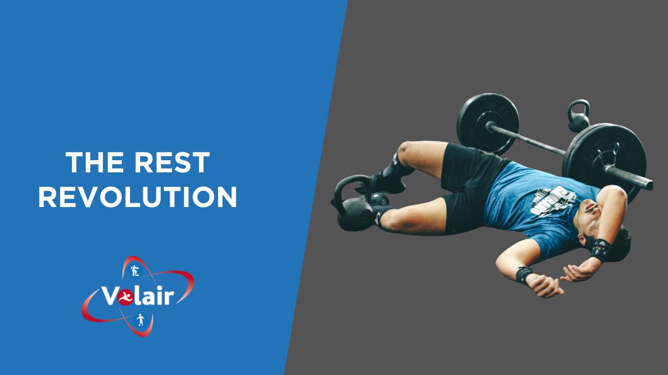 Rest revolution on a black and grey. with someone resting on the floor after a tough deadlift 
