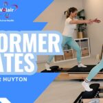 Promotion for reformer Pilates in big highlighted writing blue background and image underlayer of of two people using a reformer.