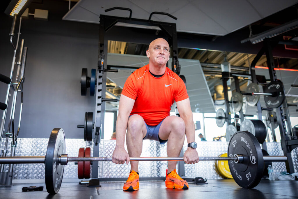 member conducting strength training