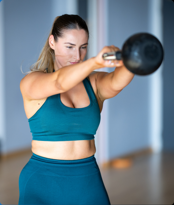 Woman exercising with a kettlebell. for national fitness day